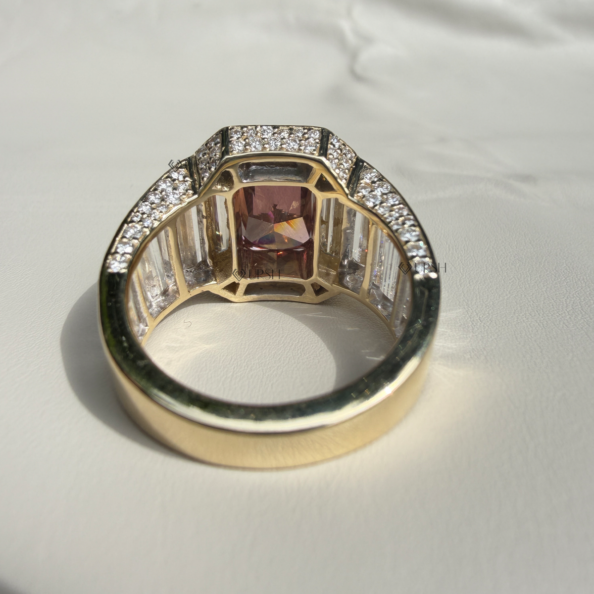 Studio rear view of architectural ruby statement ring showing solid gold foundation and stone alignment