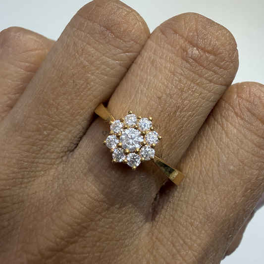 Detailed daylight close-up of round lab diamond flower cluster ring showing facet fire on hand