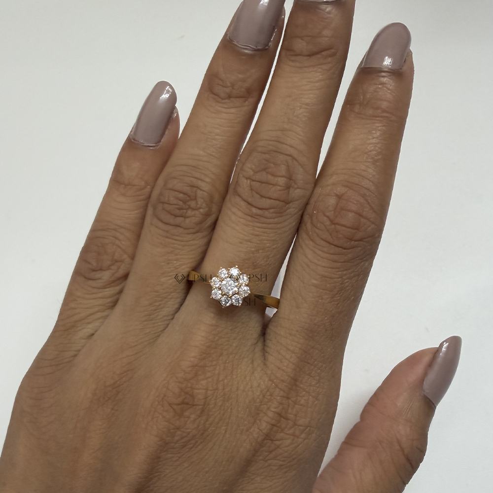 Dainty floral cluster ring worn on finger highlighting elegant proportions