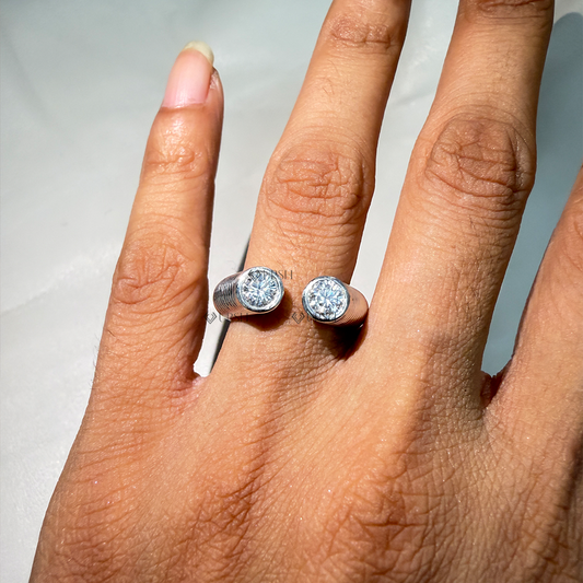 Modern two-stone open gap diamond cuff ring worn on hand