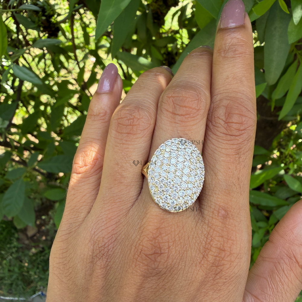 Dramatic finger coverage of large oval diamond pavé dome ring styled on hand