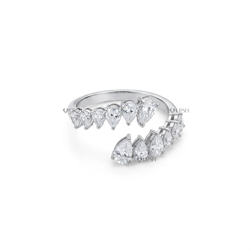 Solid white gold spiral wrap eternity ring set with graduated teardrop diamonds