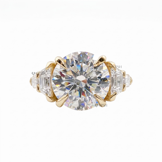 Solid yellow gold brilliant and step-cut multi-stone engagement ring on clean white backdrop
