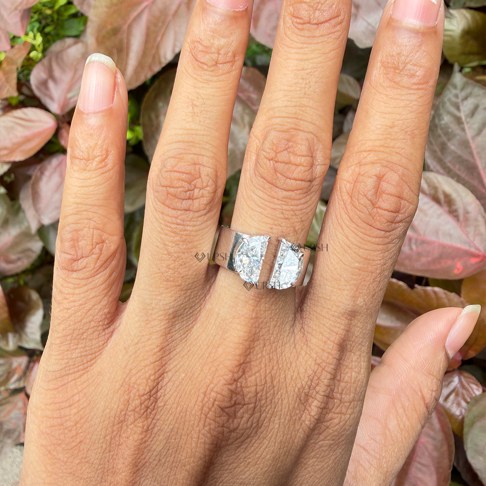 Wide cigar band with open gap half moon diamonds worn on ring finger