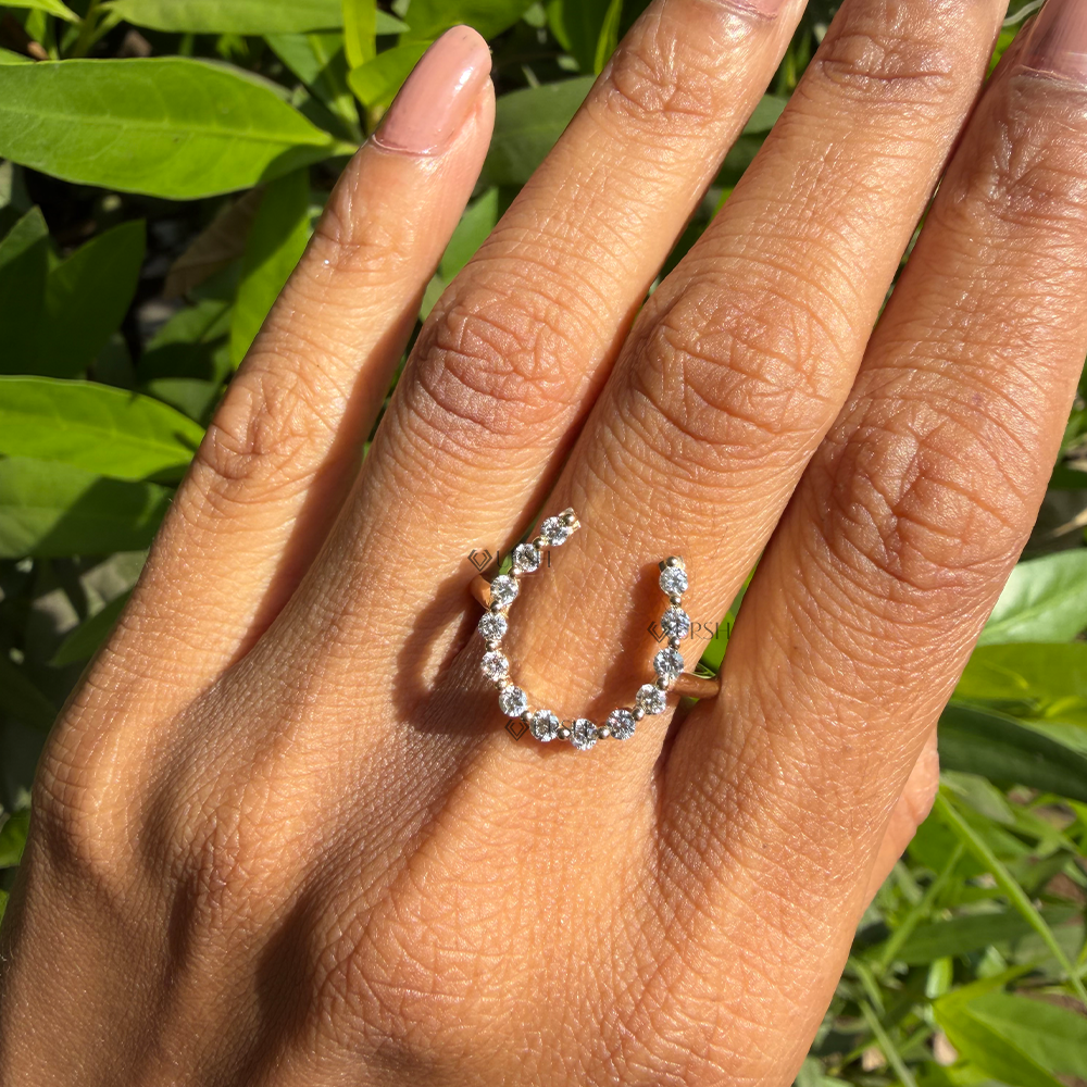 Dainty yet striking diamond horseshoe knuckle band styled across finger
