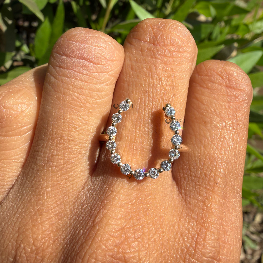 Detailed macro view of shared prong lab diamond sparkle along open horseshoe curve