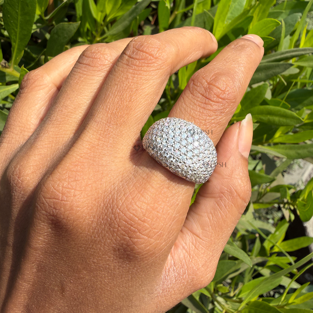 White gold lab diamond egg dome ring catching afternoon sunlight on hand