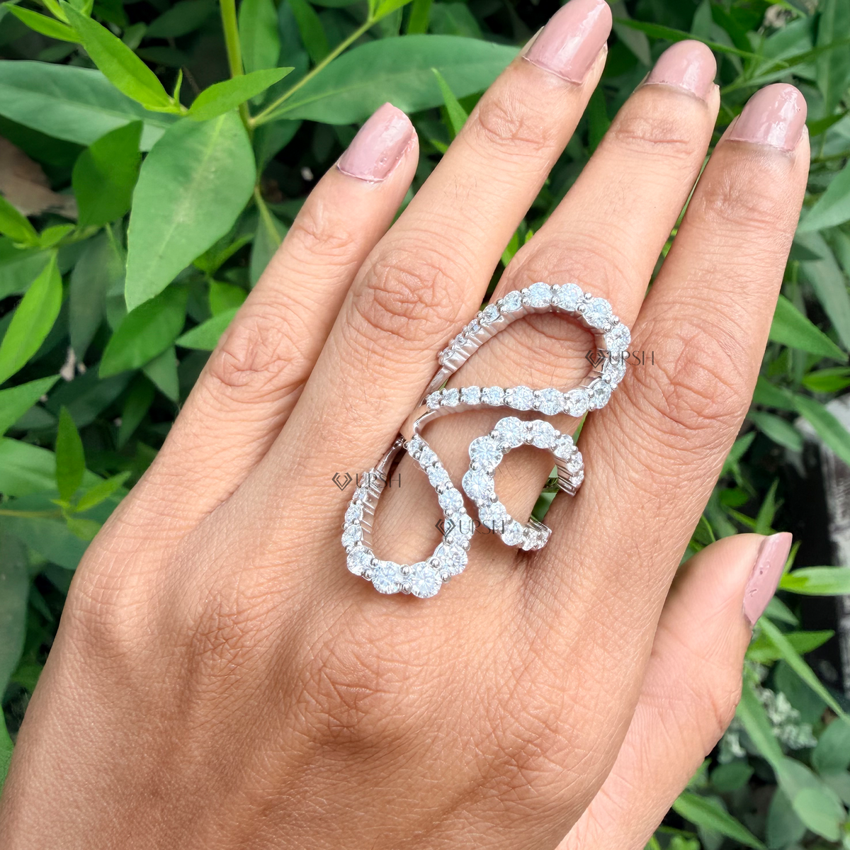 Striking multi-finger statement ring worn on hand showcasing high-impact architectural proportions
