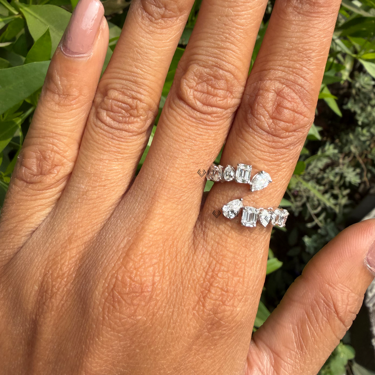 Daylight perspective of mixed-cut diamond wrap ring worn on hand