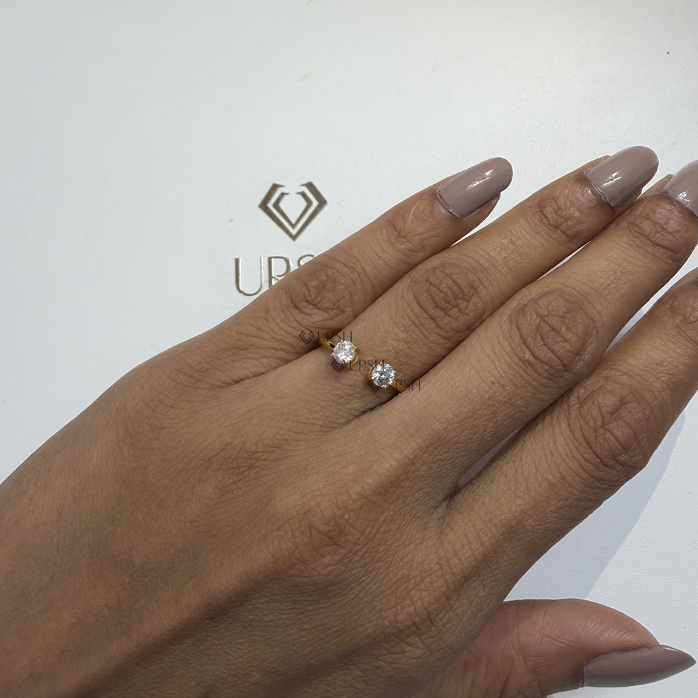 Solid gold modern open gap diamond ring styled on hand in studio lighting