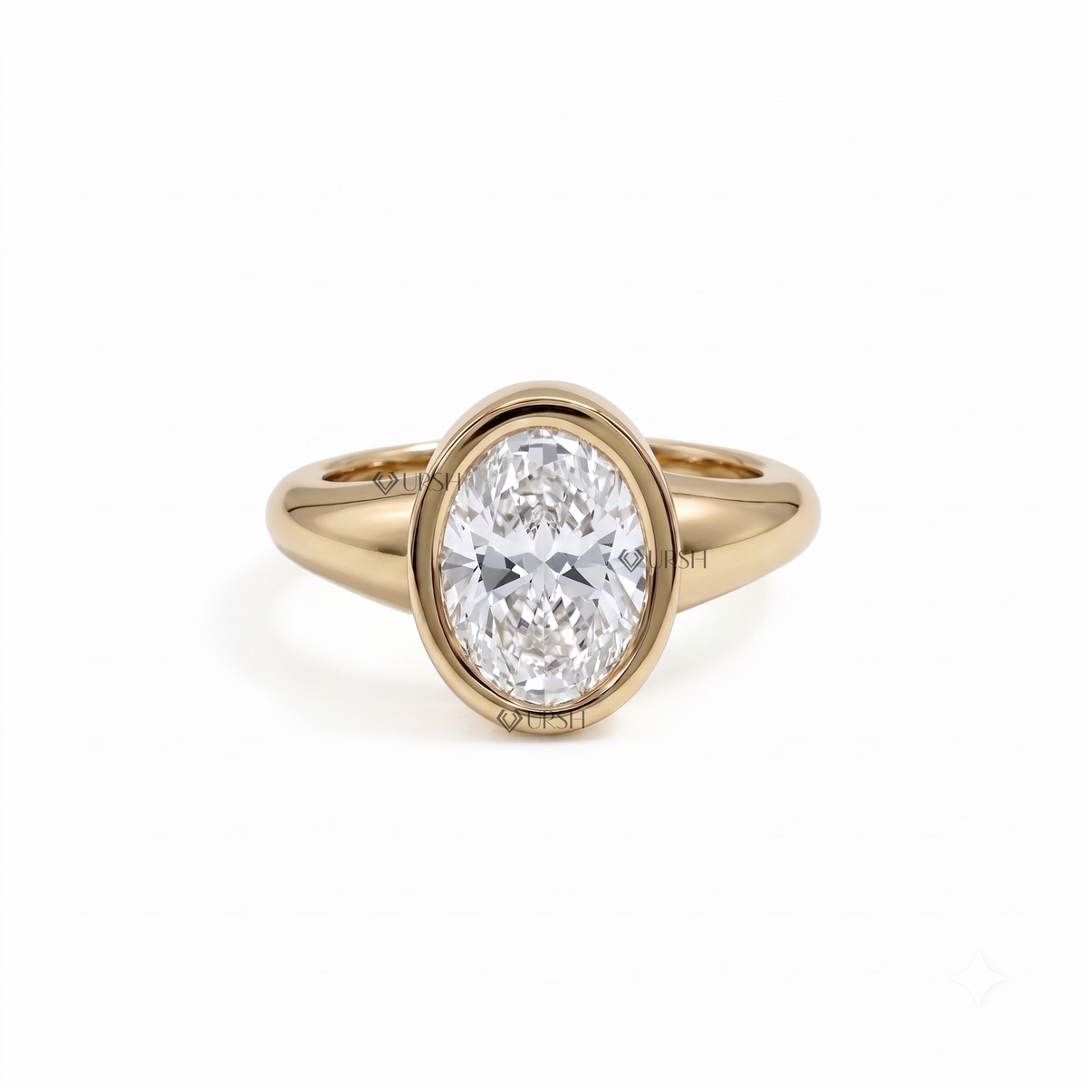 Solid yellow gold oval bezel-set engagement ring on clean white background