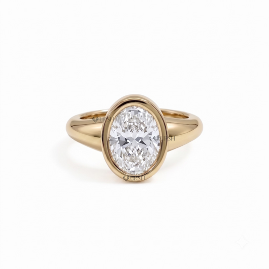 Solid yellow gold oval bezel-set engagement ring on clean white background