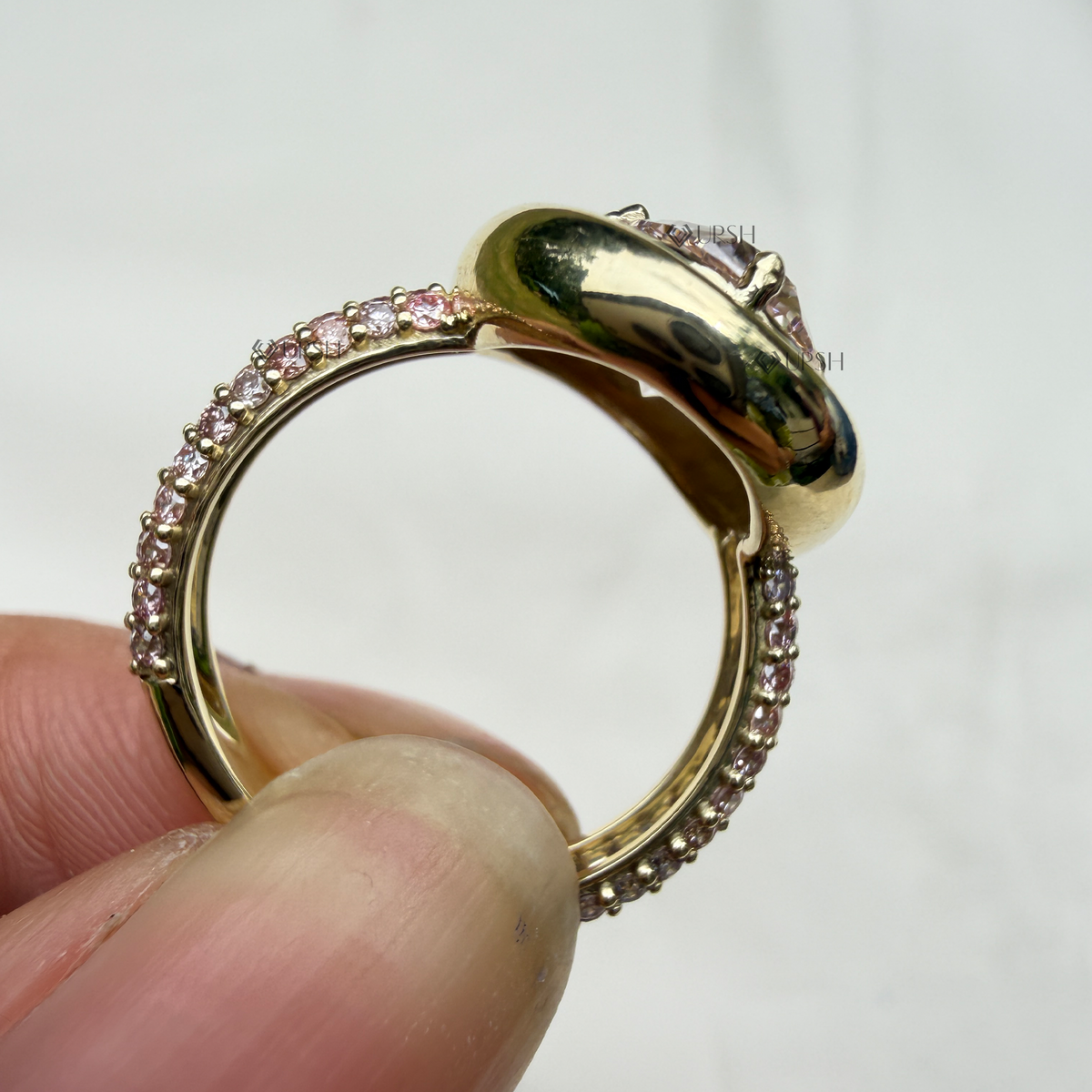 Under-finger view displaying solid gold comfort-fit inner shank and smooth gallery backing