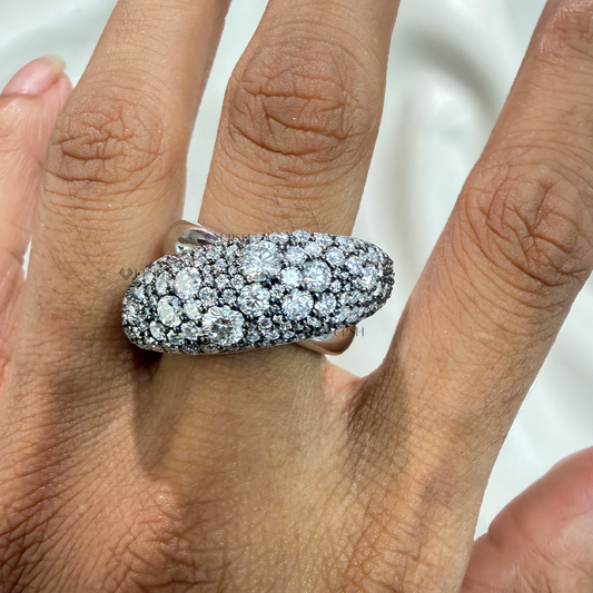 Chunky diamond bombé dome statement ring worn on finger showing substantial knuckle coverage