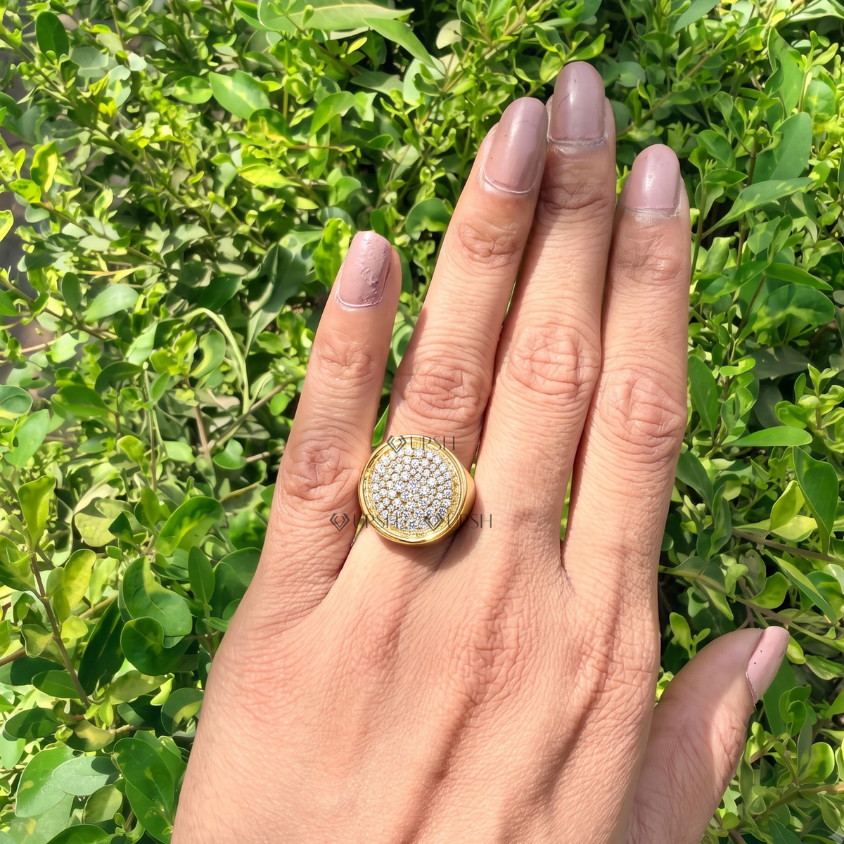 Striking pavé disc signet ring worn on hand showcasing bold circular proportions