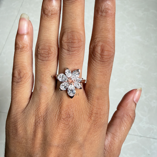 Eye-catching finger presence of diamond flower cluster ring worn in natural light