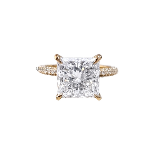 Solid yellow gold radiant cut lab grown diamond engagement ring with micro-pavé band and hidden halo