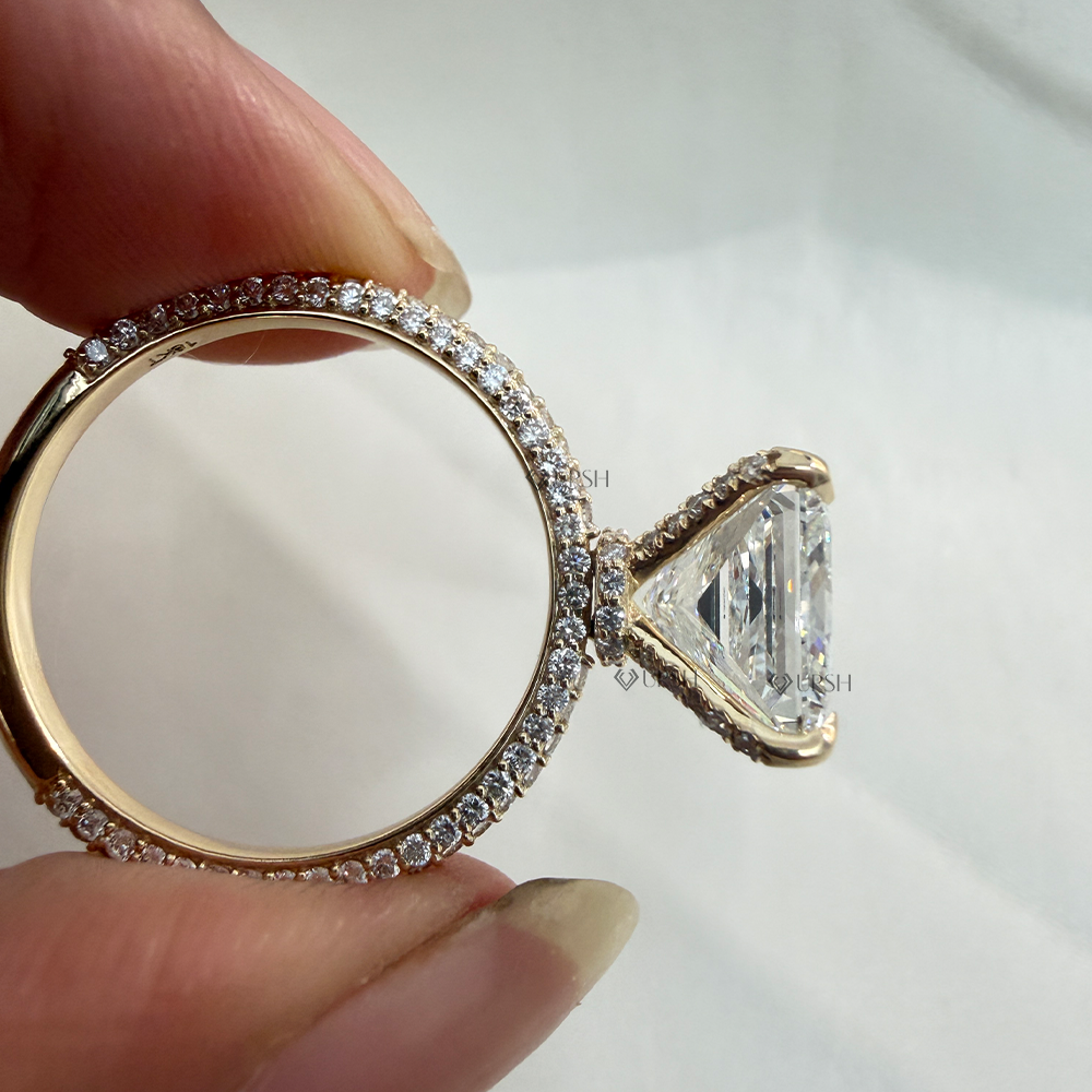 Studio side view showing elevated 4-corner prongs, hidden halo gallery, and micro-pavé band