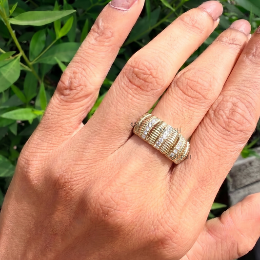 Chunky ribbed statement band styled gracefully on finger in natural daylight