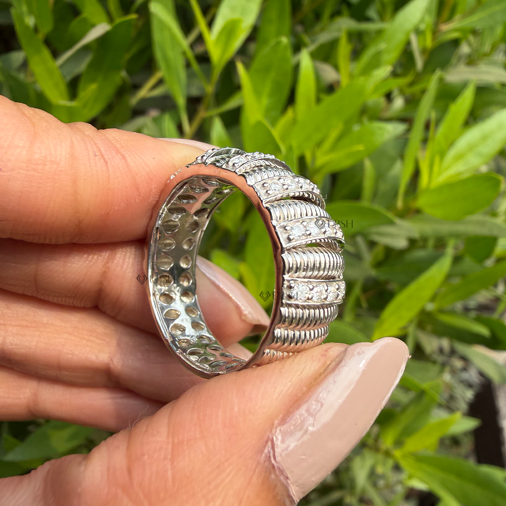Under-finger view displaying honeycomb open-work interior gallery and solid comfort-fit band