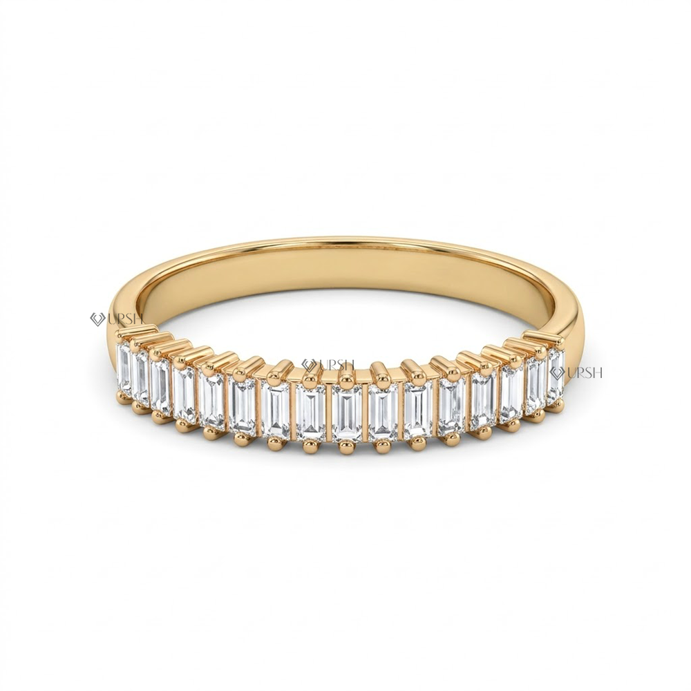 Solid yellow gold shared prong baguette diamond wedding ring on clean white backdrop
