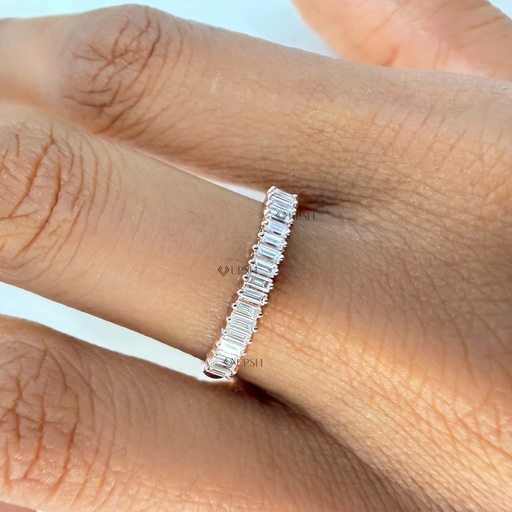 Minimalist straight baguette cut diamond band catching light across the hand