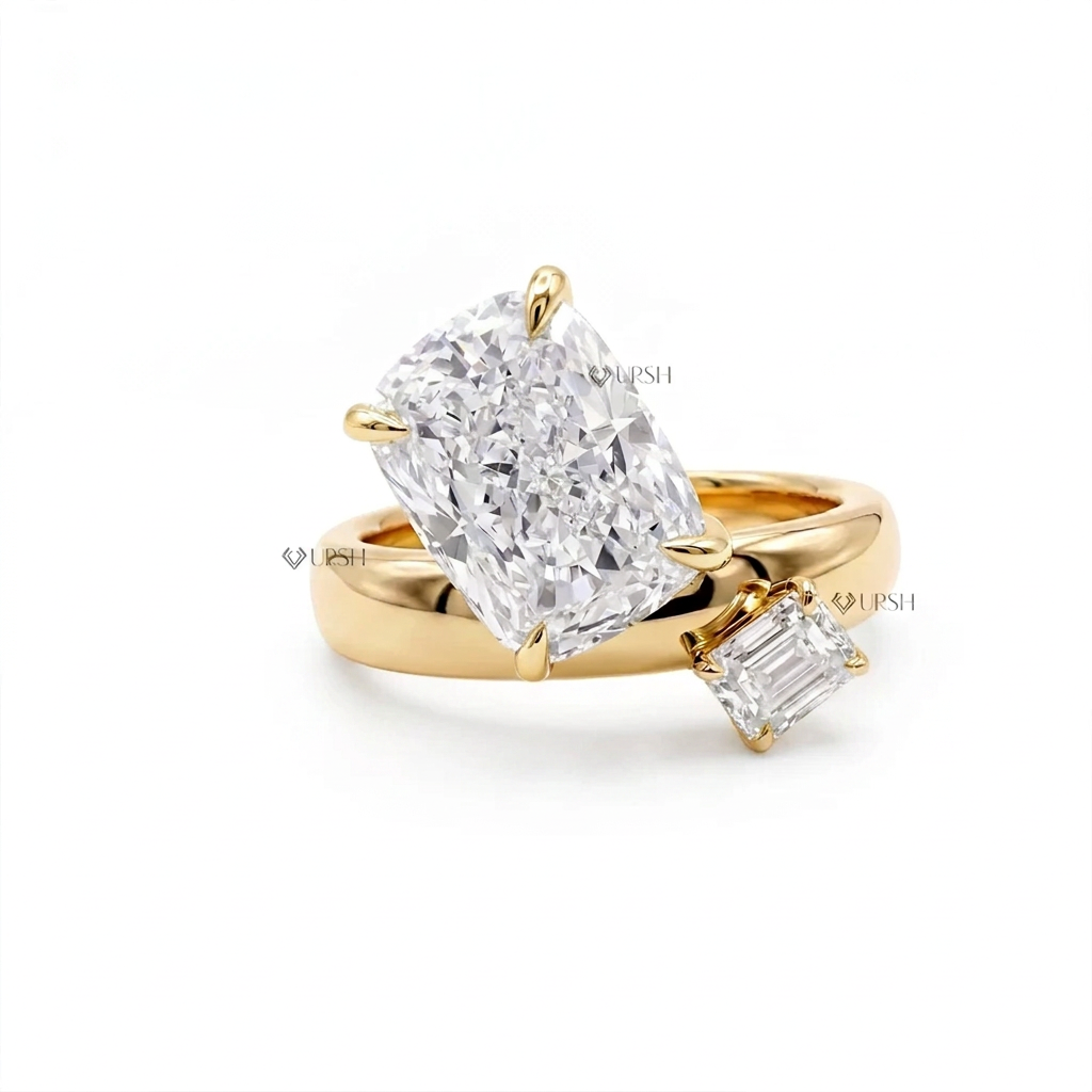 Solid yellow gold Toi et Moi bypass engagement ring featuring two-tone prong-set elongated cushion and emerald cut lab diamonds on chunky dome band