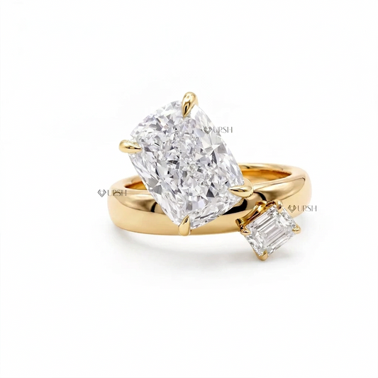 Solid yellow gold Toi et Moi bypass engagement ring featuring two-tone prong-set elongated cushion and emerald cut lab diamonds on chunky dome band
