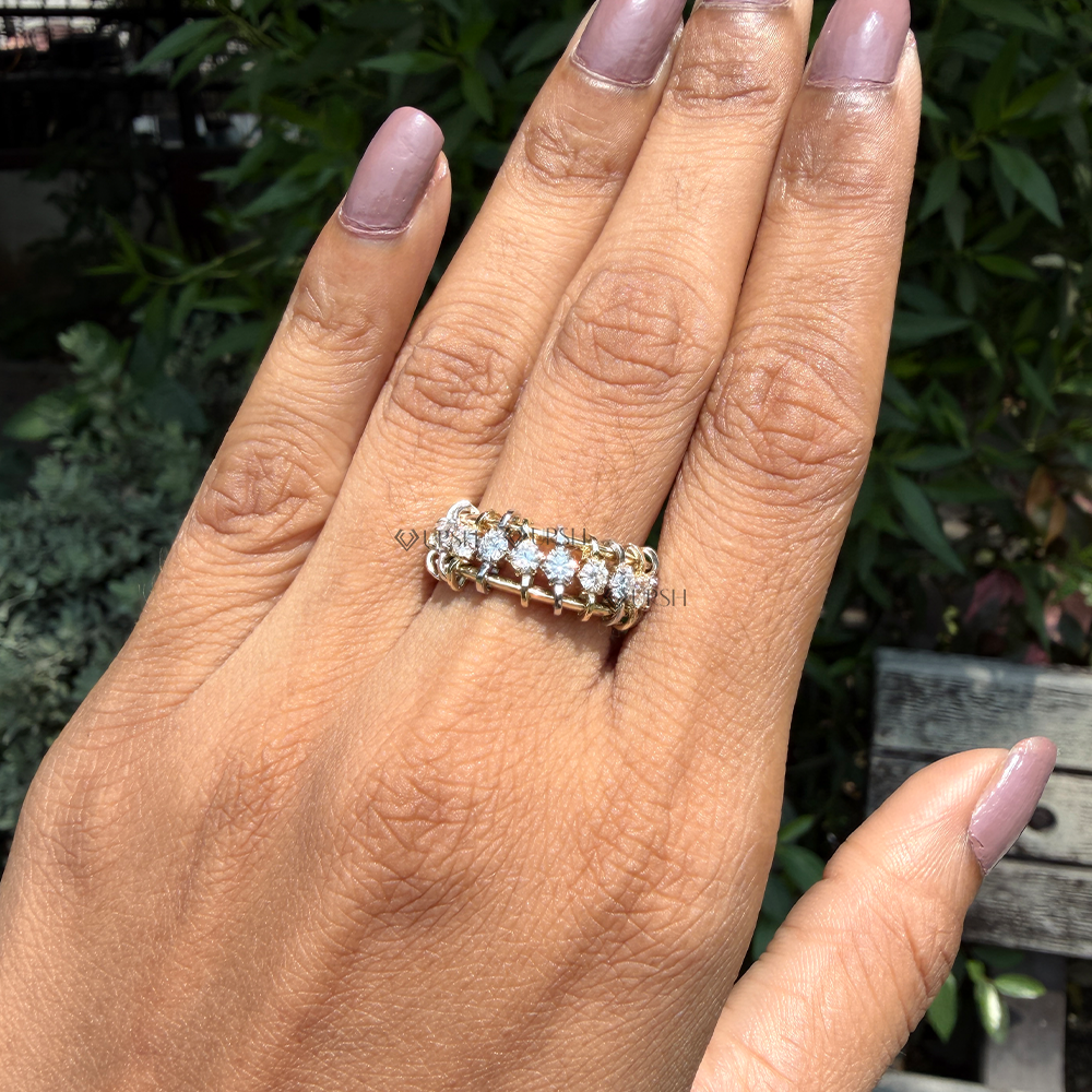 Substantial finger coverage of two-tone open ladder diamond ring worn on finger