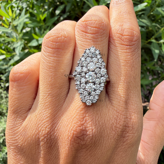 Vintage marquise shield diamond statement ring worn on finger in natural daylight