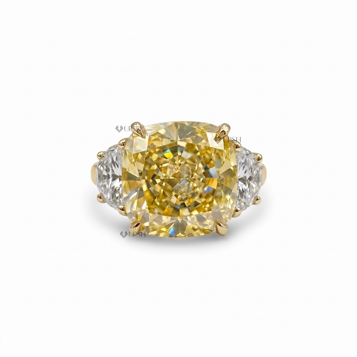 Canary yellow cushion diamond three-stone solid gold ring presented in an open velvet jewelry box