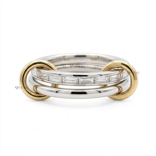 Solid two-tone gold interlocking statement ring featuring a channel of baguette diamonds linked by yellow gold end loops