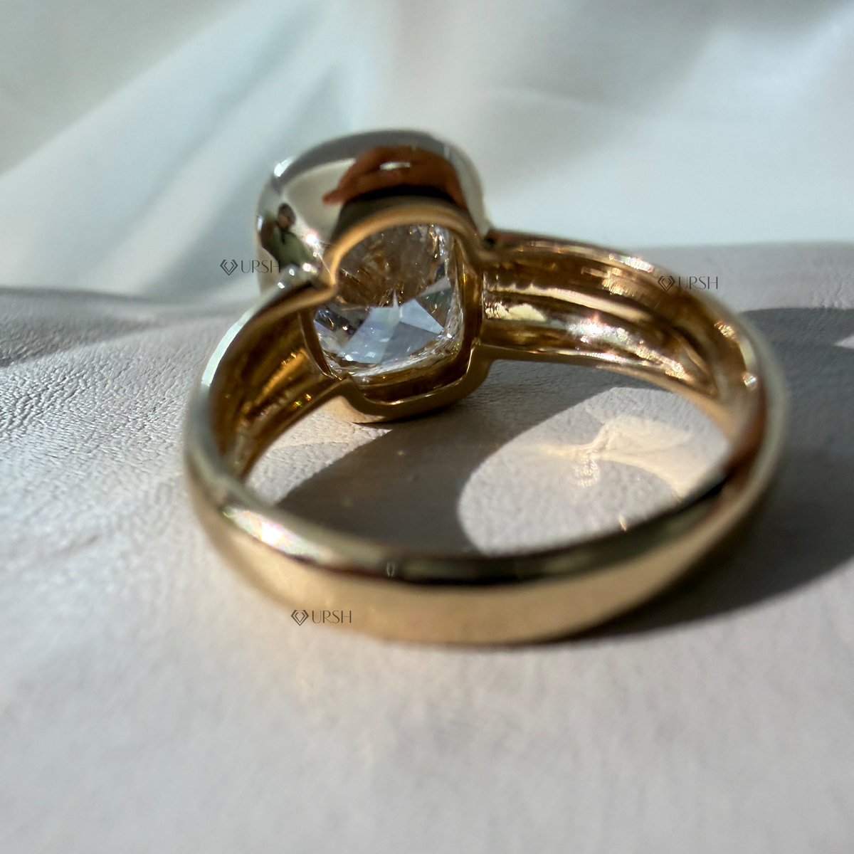 Side angle highlighting hollowed under-gallery basket and thick solid gold shank
