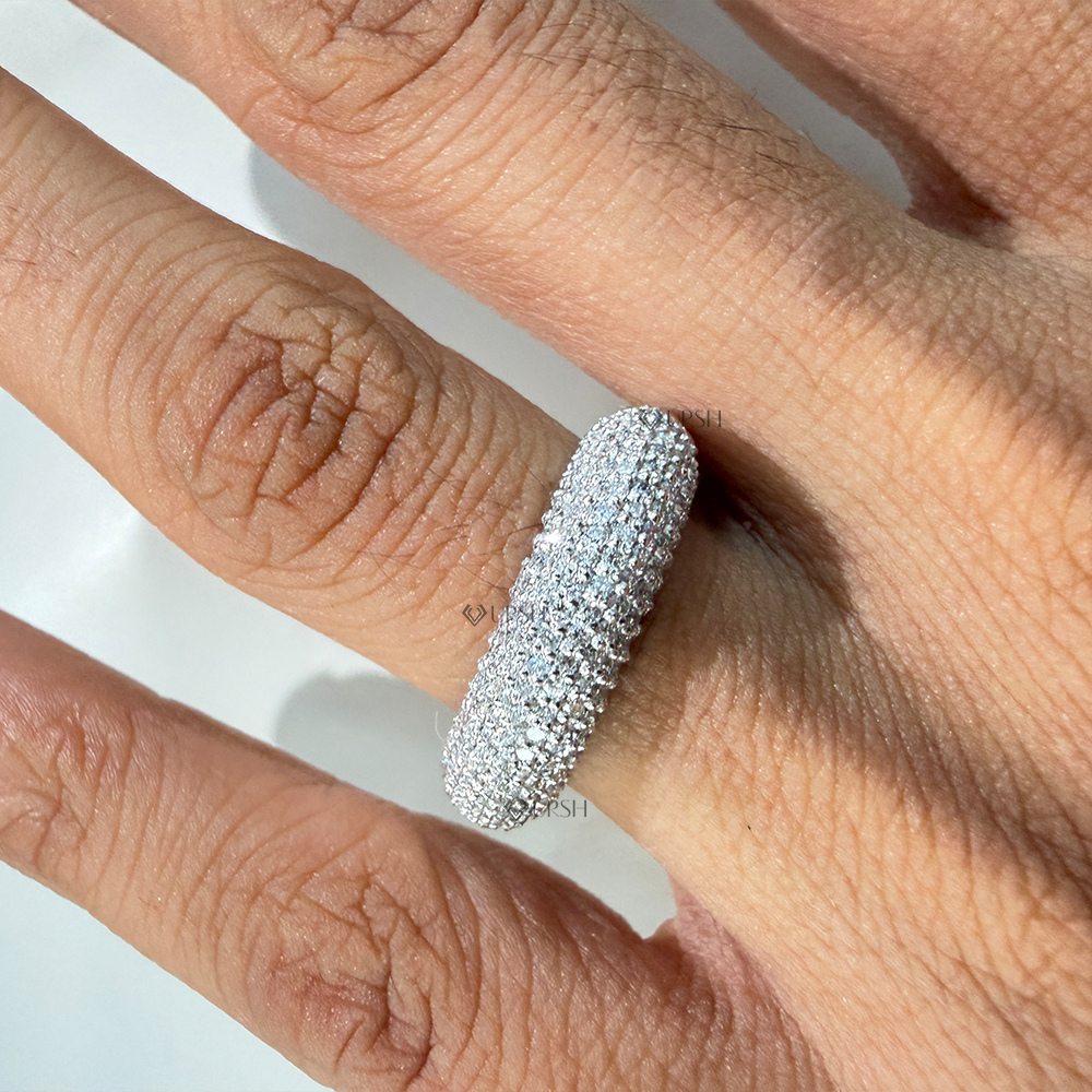 Full pavé dome statement ring worn on finger against natural background displaying high brilliance