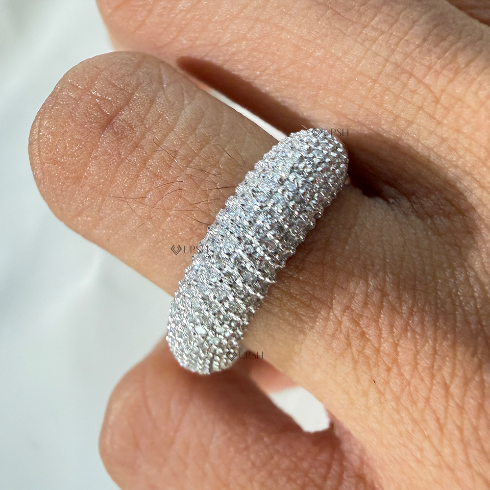 Chunky pavé dome ring styled gracefully on finger in natural daylight showcasing bold volume