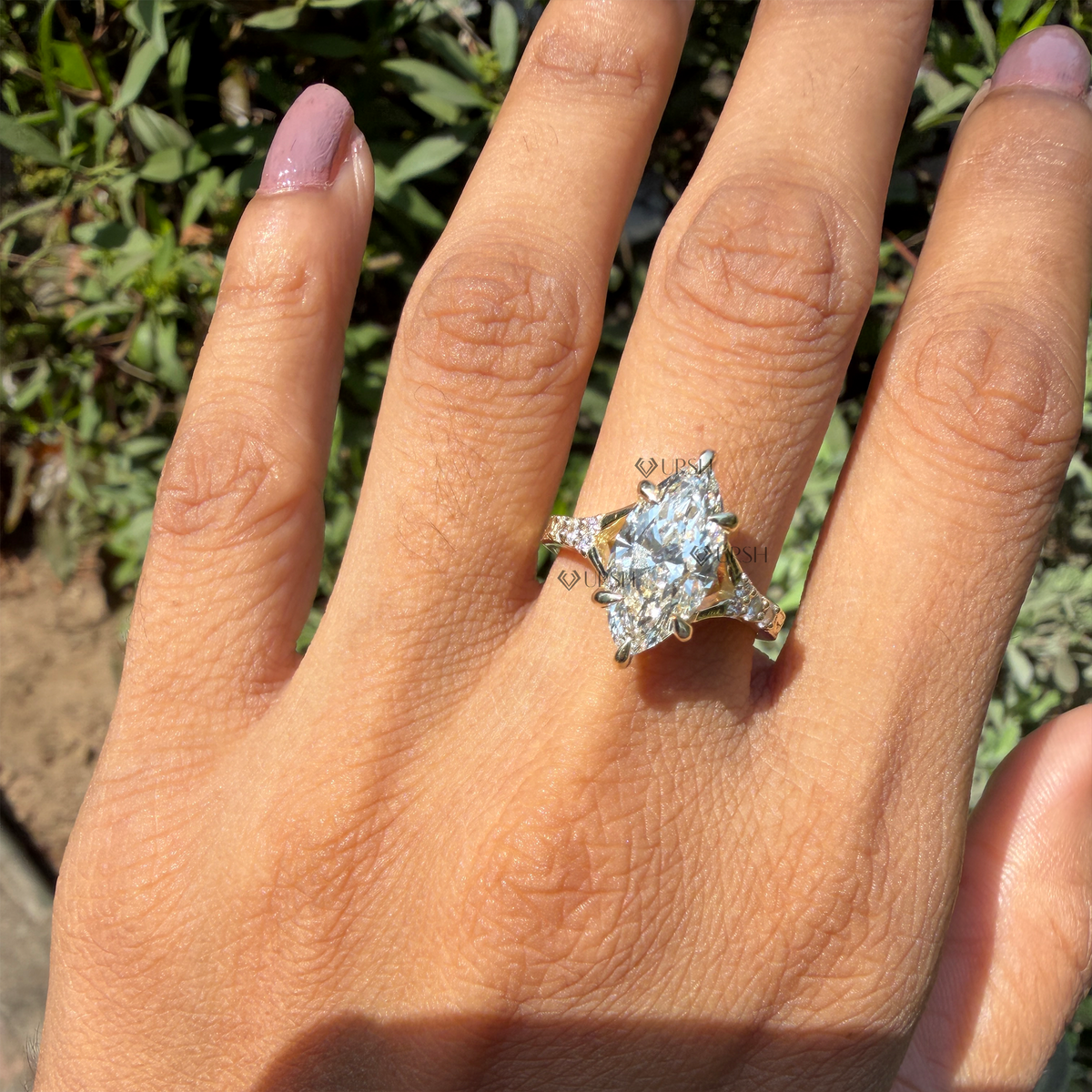 Hand close-up highlighting sparkle and finger coverage of vintage marquise diamond band